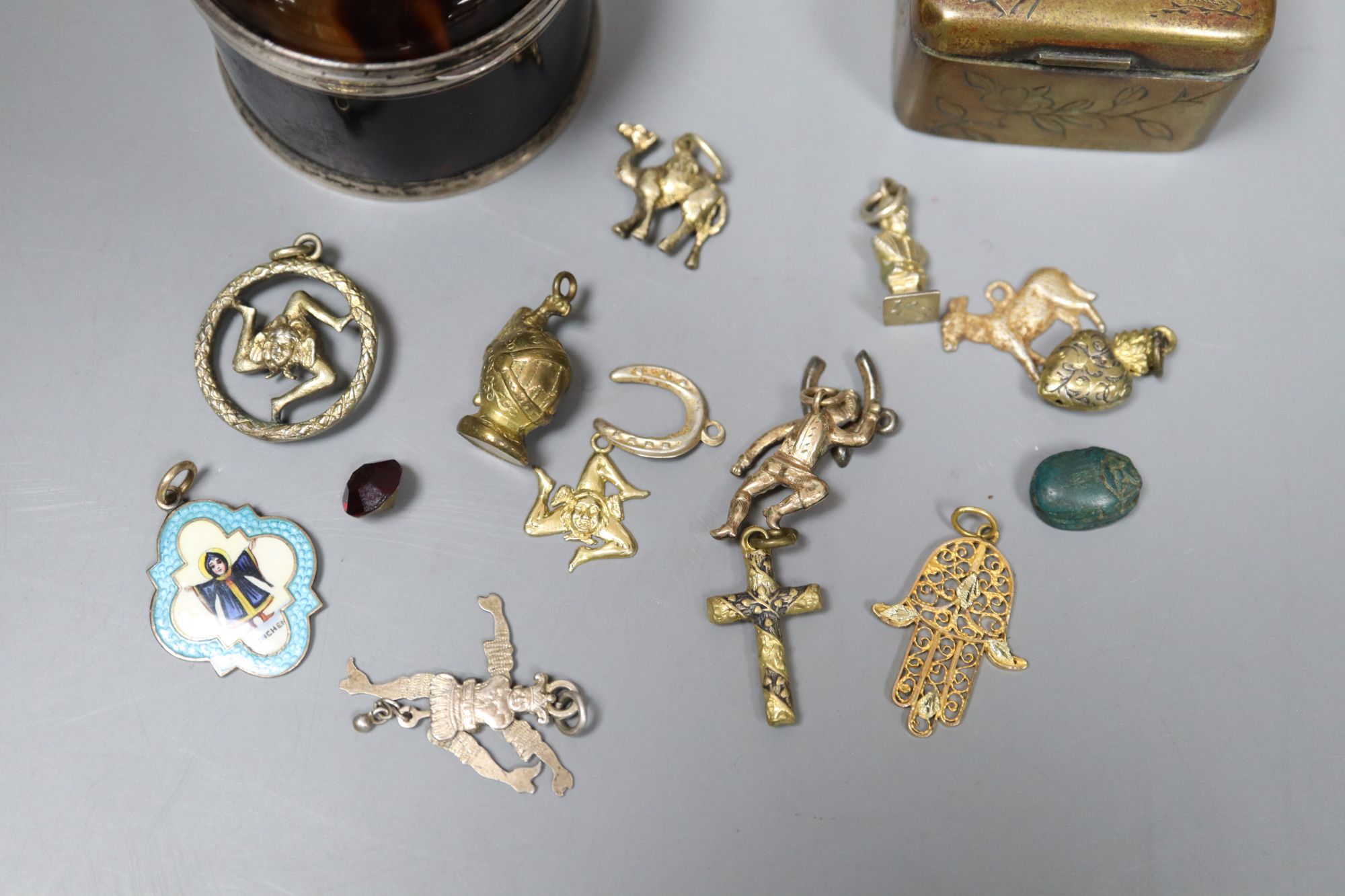 A late Victorian silver mounted tortoiseshell box, (a.f.) one other base metal box and a group of assorted metal charms.